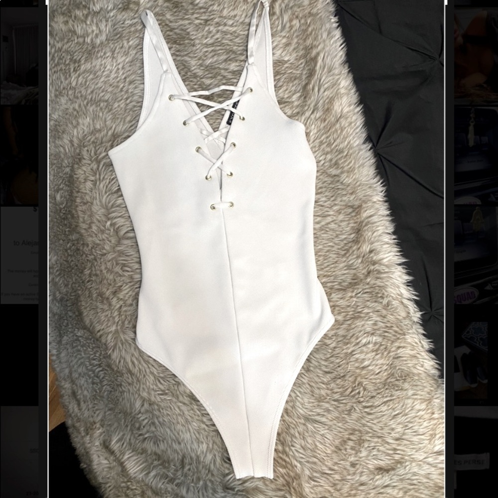 Express white lace up front bodysuit. Xs